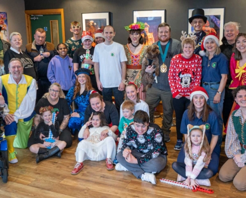 PAG helpers, children and Panto Stars pose for a group photo