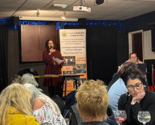 Questions being asked and a team in deep thought at a table